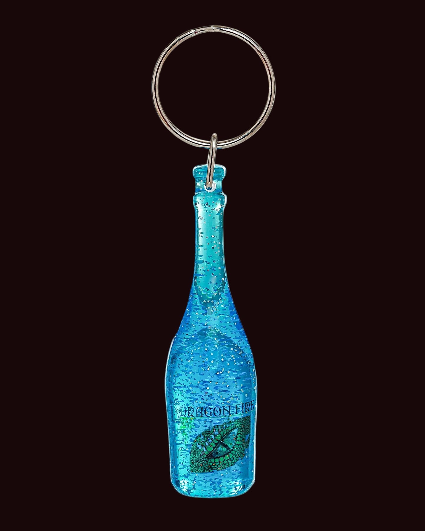 Blue bottle-shaped keychain with a metallic ring on a white background