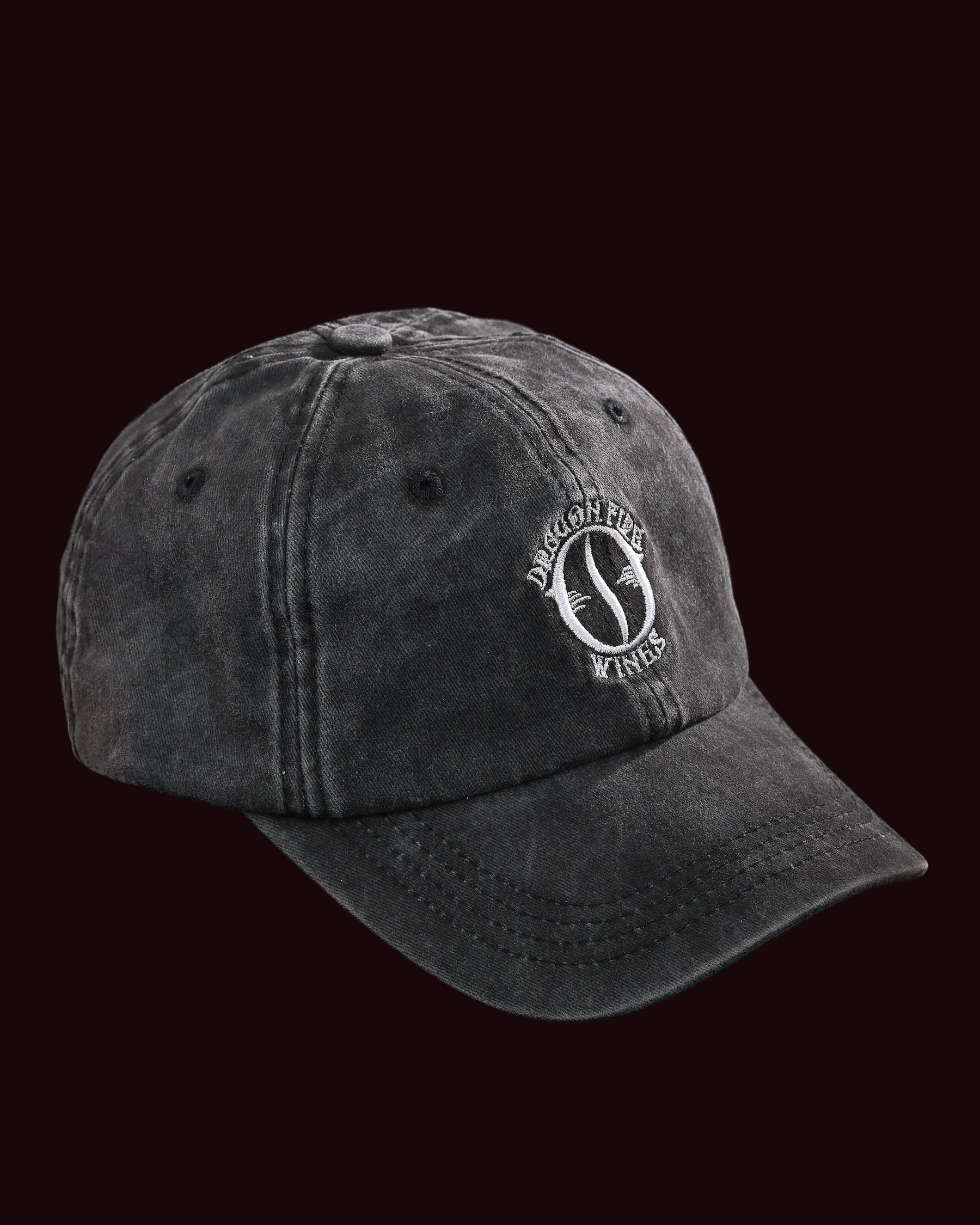 Black cap with a logo on a black background